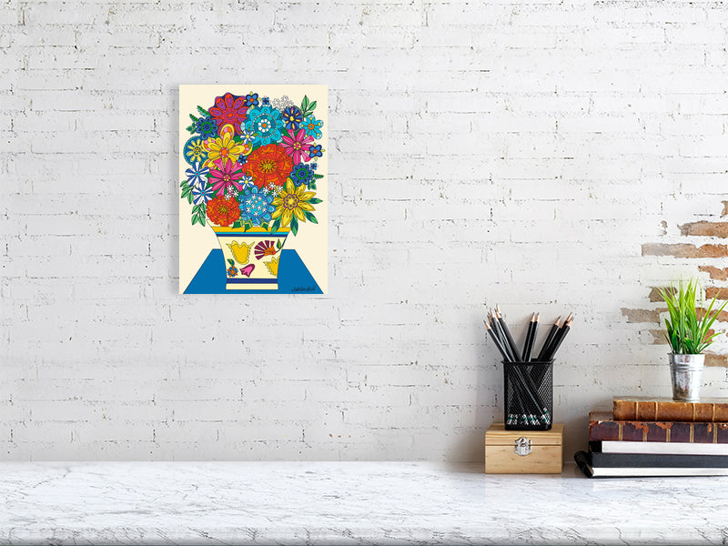 Colorful floral artwork on a white brick wall above a desk.