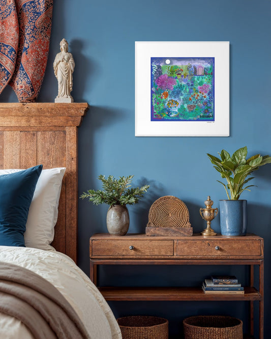 ‘Midnight Garden’ limited edition colourful atmospheric garden themed print with colorful floral and abstract details. Shown in w white frame on a teal blue wall in a bedroom setting