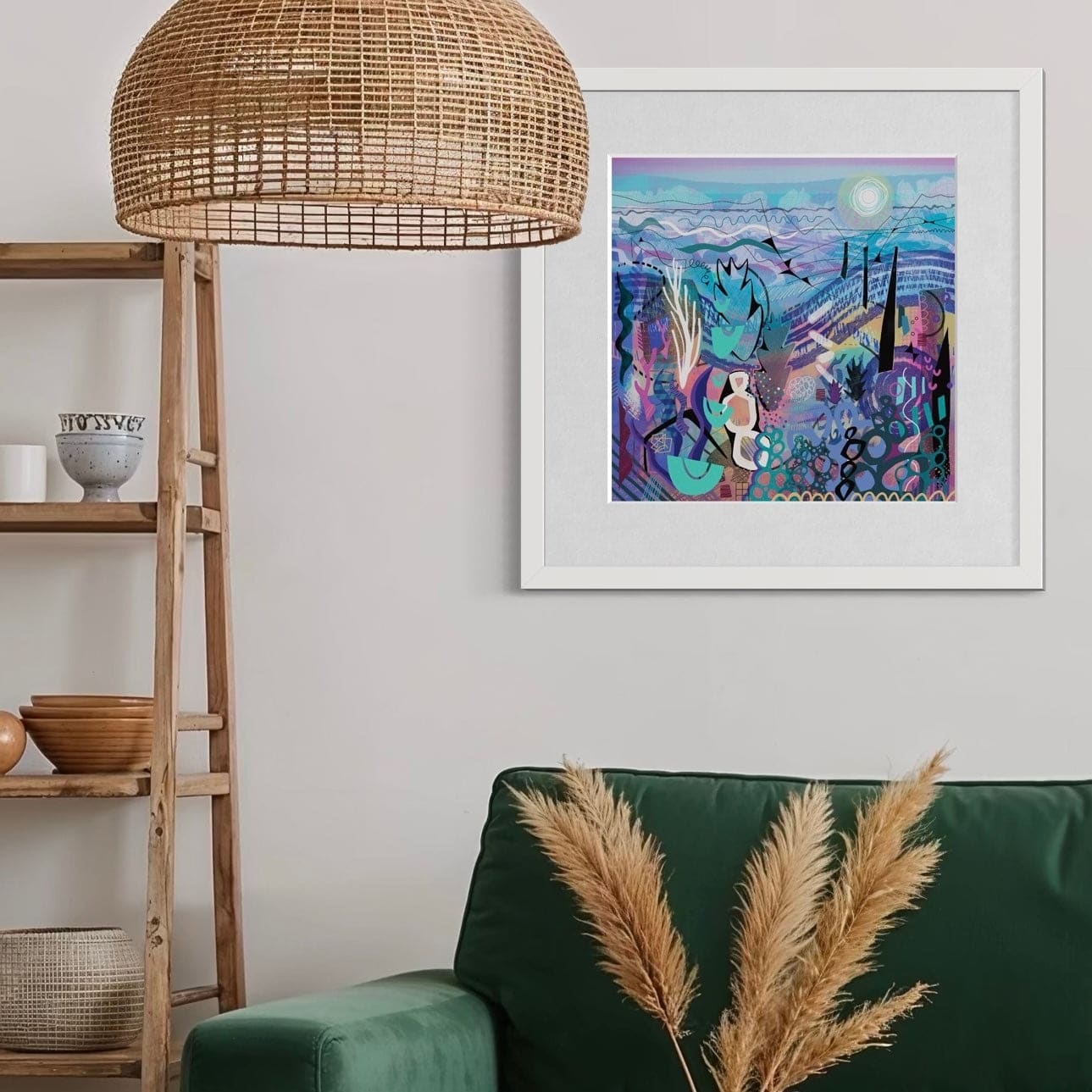 Living room with a green sofa, wooden coffee table, and a colorful abstract art print by Uk artist Ruth Dronsfield on the wall.
