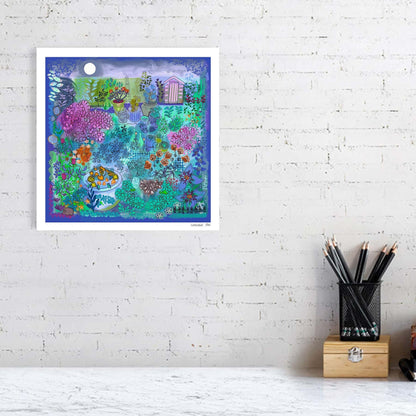 Limited edition fine art print by Ruth Dronsfield. A stylised colourful image of a Nightime garden scene. Shades of purple, green with pinks and orange and detailed line work. Plants, flowers, moon, shed and hedgehog features. Shown unframed against a white brick wall above a desk with stationary