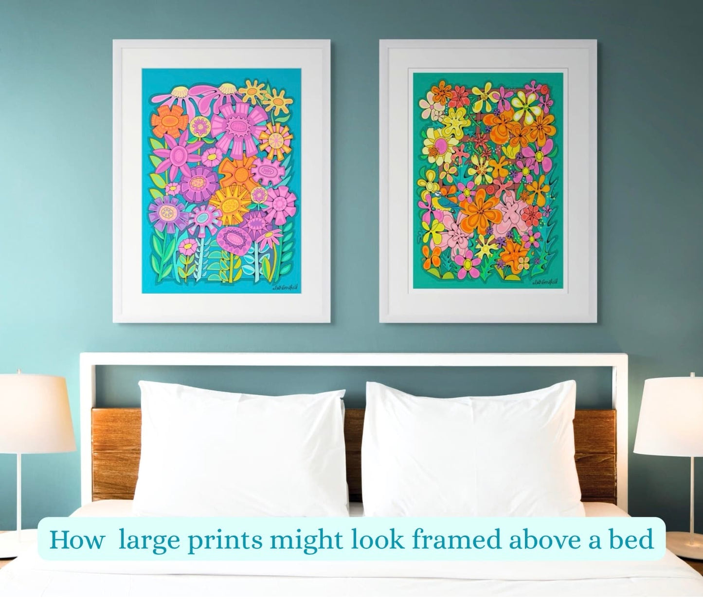 Two large floral prints hanging above a bed