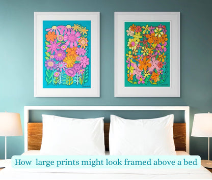 Two large floral prints hanging above a bed