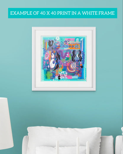 Framed colourful abstract art print 'Afloat' by Ruth Dronsfield hanging on a aqua green wall above a white sofa with a lamp