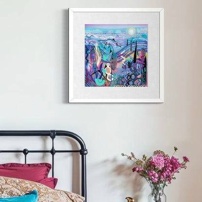 Framed abstract art print 'Mauve' by Uk artist Ruth Dronsfield. On a wall above a bed with floral decorations.